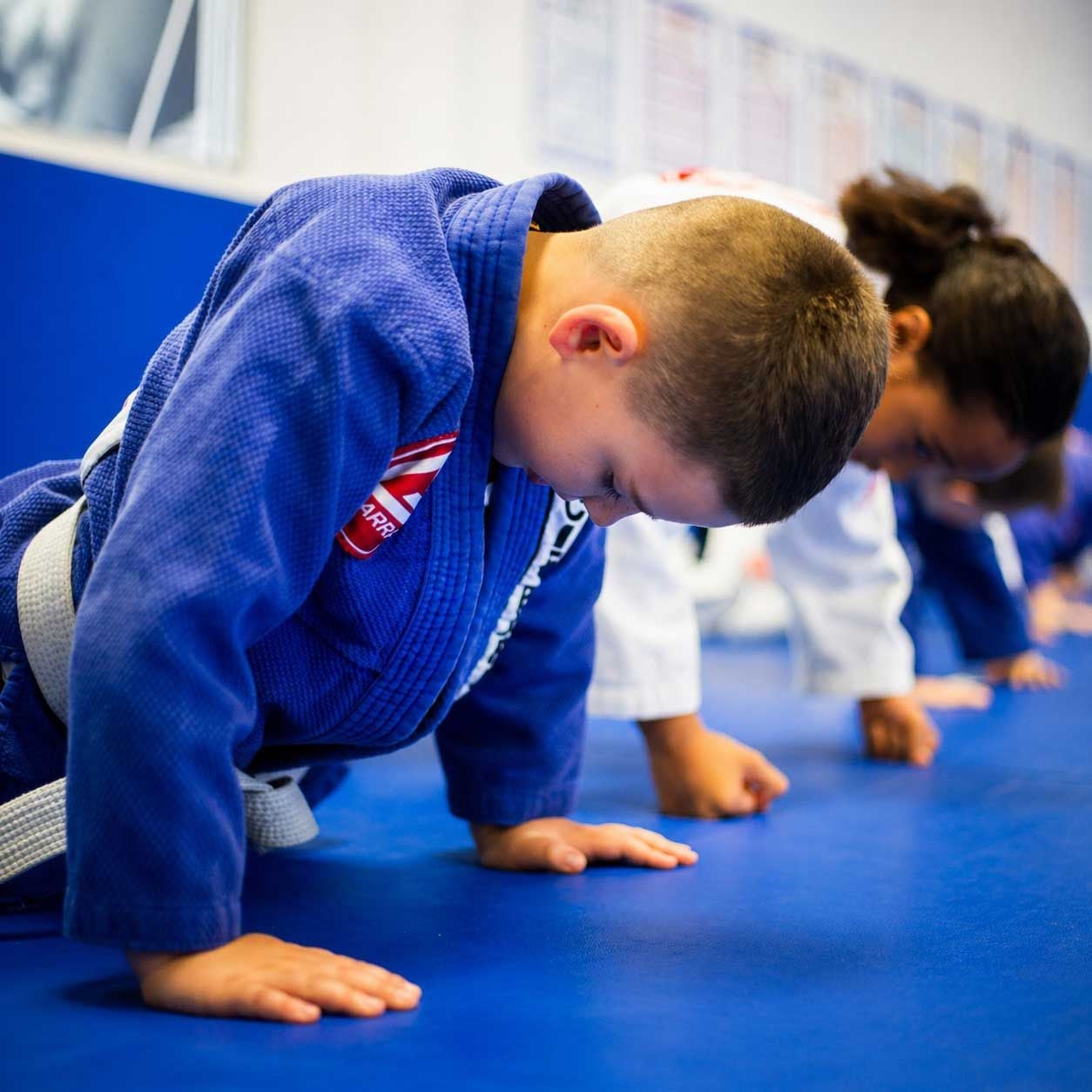 A young Gracie Barra Burleigh Heads student giving full effort on the mat